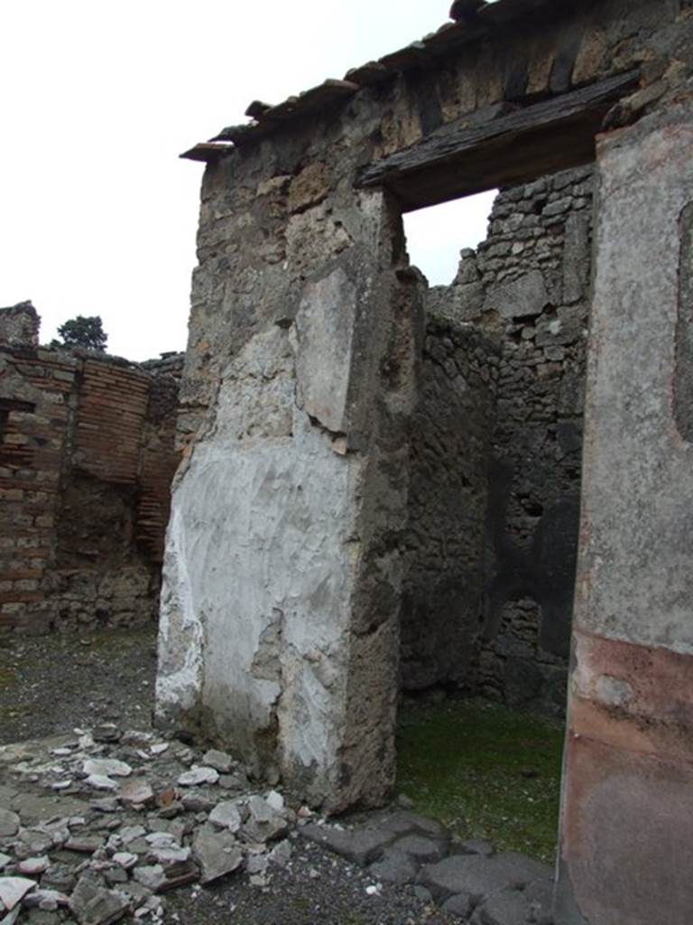 VI.10.11 Pompeii. March 2009. Room 3, atrium with plaster fallen from wall next to doorway of room 5.