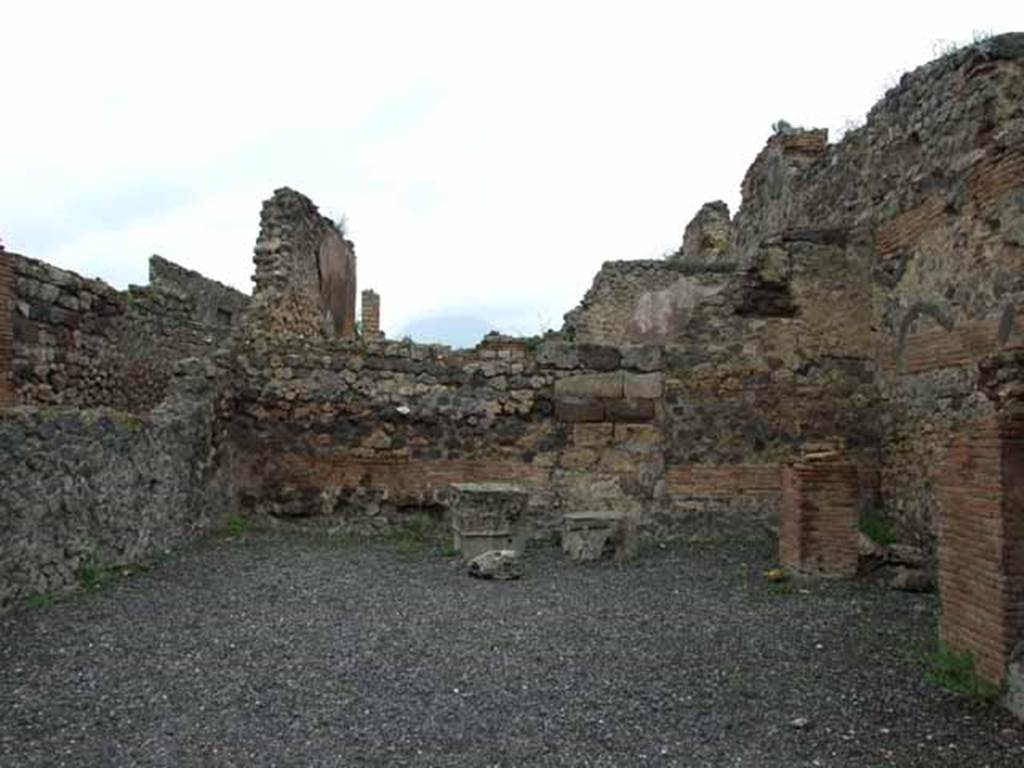 VI.10.15 Pompeii. May 2010. Looking towards north wall, with two tufa capitals nearby.