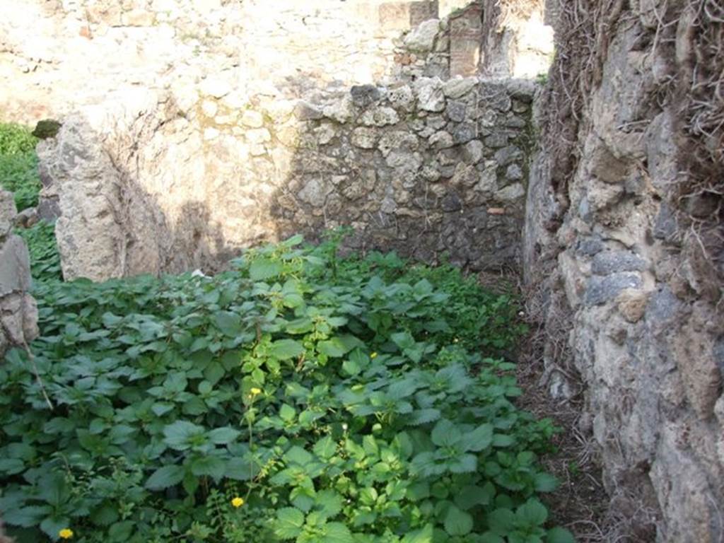 VI.11.2 Pompeii. December 2007. Site of steps to upper floor, above a room with a doorway, on left, into shop-room of VI.11.1