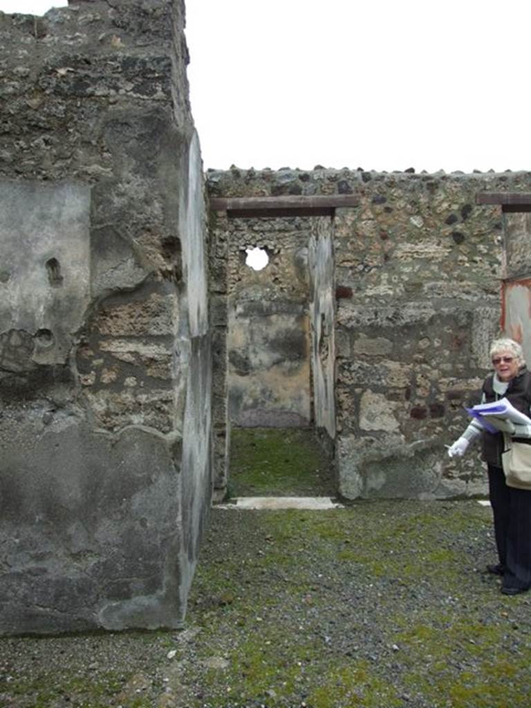 VI.11.9 Pompeii. March 2009. Doorway to room 4, corridor leading to room 5. Looking west.