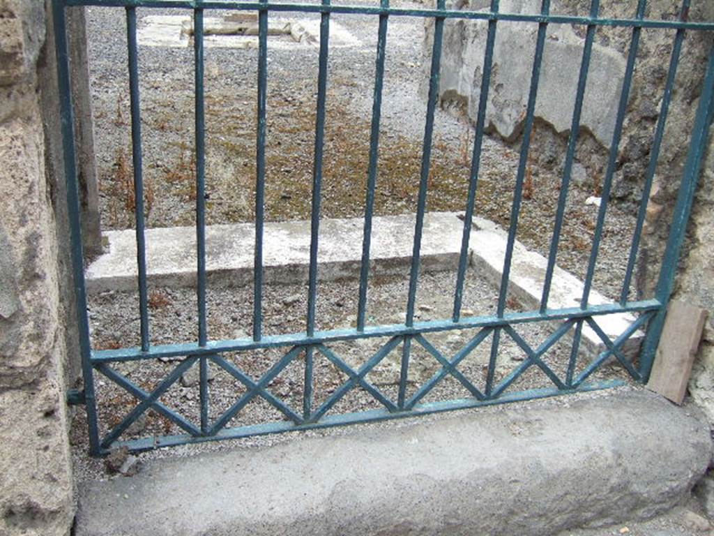 VI.11.9Pompeii.  Detail of entrance step