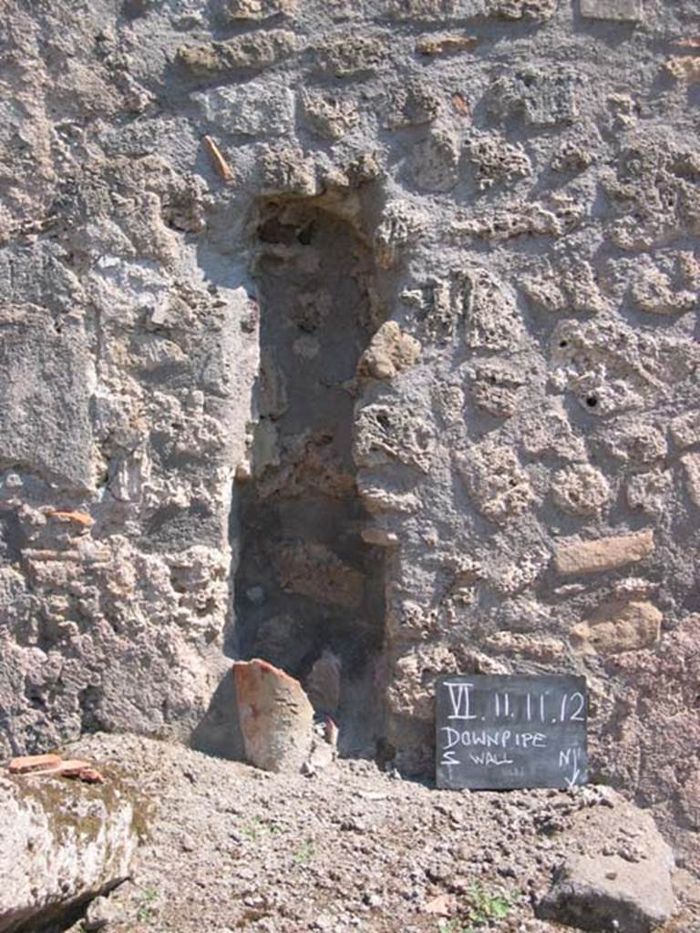 VI.11.11Pompeii. July 2008. Downpipe in south wall. Photo courtesy of Barry Hobson.