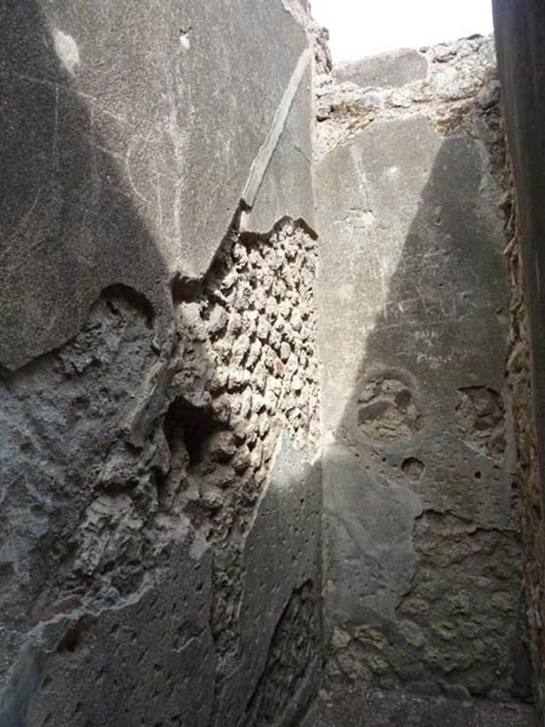 VI.12.2 Pompeii. September 2015. Looking east in small room, with remains of imprint of stairs to upper floor in plaster on north wall.