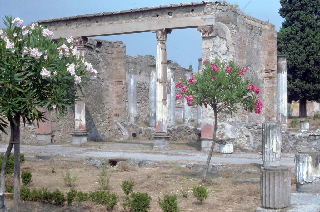 VI.12.2 Pompeii. August 1976. Looking north-west across first (middle) peristyle towards Exedra.
Photo courtesy of Rick Bauer, from Dr George Fay’s slides collection.
