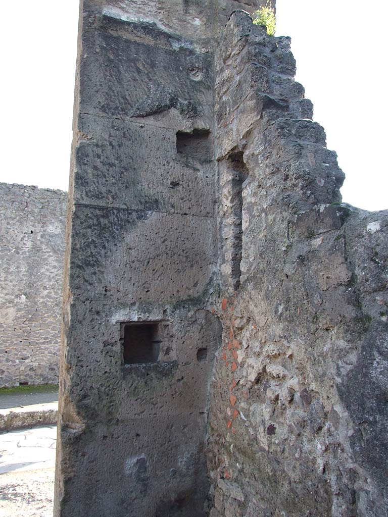 VI.12.4 Pompeii. December 2006. South-west corner of shop, on left side of doorway.
According to Boyce, in the south wall to the left of the entrance, is a rectangular niche.
See Boyce G. K., 1937. Corpus of the Lararia of Pompeii. Rome: MAAR 14. (p.52, no.191) 
