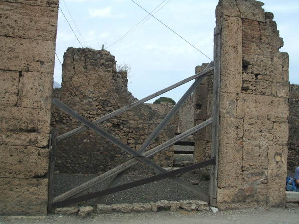 VI.13.1 Pompeii. May 2005. Shop entrance doorway.  According to Pagano and Prisciandaro, a graffito found in May 1831 on the pilaster between VI.13.1 and 2, on the right, was 
Holconium Priscum
verecundissimum d(ignum) r(ei) p(ublicae) aed(ilem) o(ro) v(os) f(aciatis) dignissimum.  [CIL IV 309]
See Pagano, M. and Prisciandaro, R., 2006. Studio sulle provenienze degli oggetti rinvenuti negli scavi borbonici del regno di Napoli. Naples : Nicola Longobardi. (p.145)  PAH III, 119.
For the graffiti found on the left pilaster, see further below.
