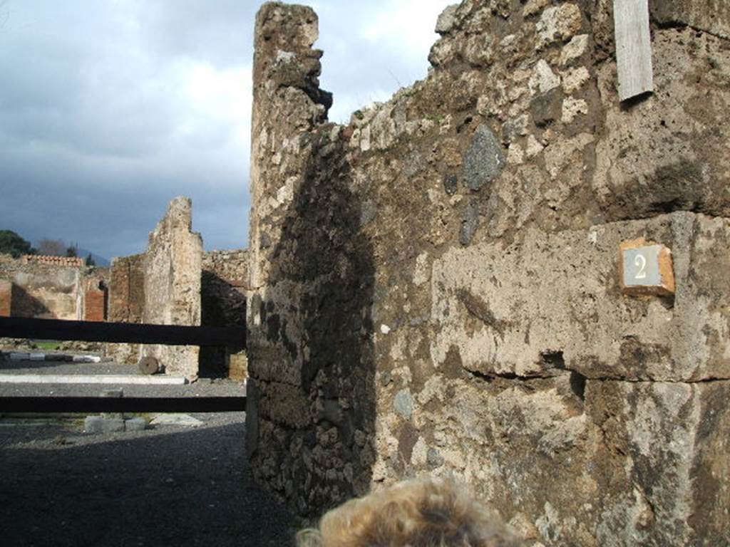 VI.13.2 Pompeii. December 2004. East wall of vestibule and fauces.
