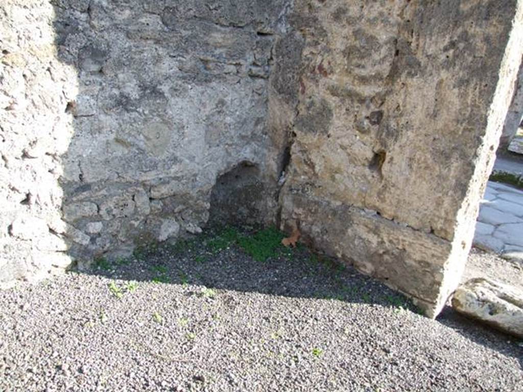 VI.13.5 South east corner with holes possibly the remains of a wooden sales counter?