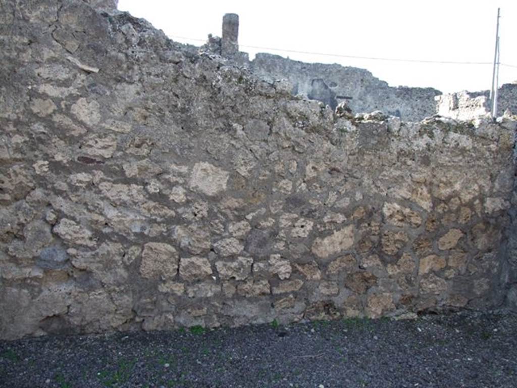 VI.13.5 Pompeii. December 2007. West wall of shop.