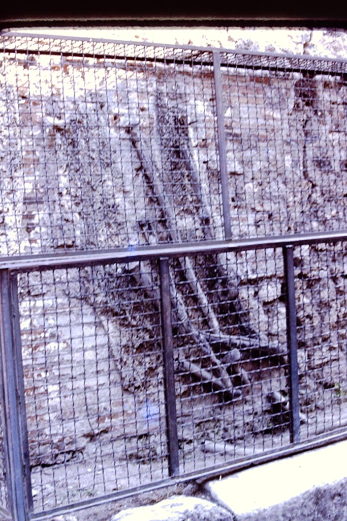 Lead pipes on back wall of VI.13.16 on Vicolo di Mercurio, Pompeii. 1980. 
Photo by Stanley A. Jashemski.   
Source: The Wilhelmina and Stanley A. Jashemski archive in the University of Maryland Library, Special Collections (See collection page) and made available under the Creative Commons Attribution-Non-Commercial License v.4. See Licence and use details.
J80f0221
