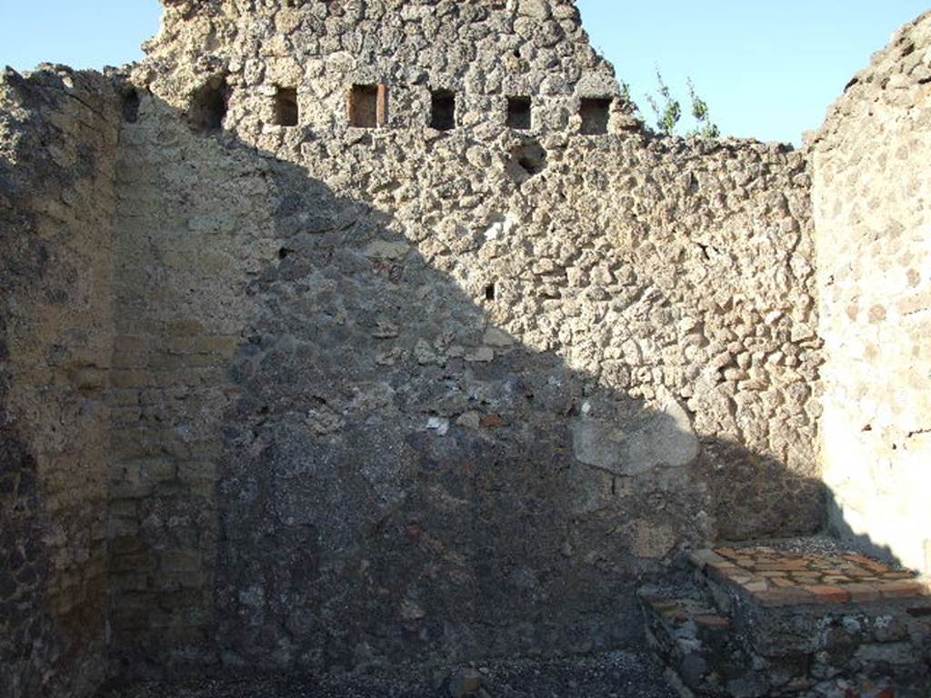 VI.14.6 Pompeii. December 2006. North wall of shop, with base of stairs in north-east corner.