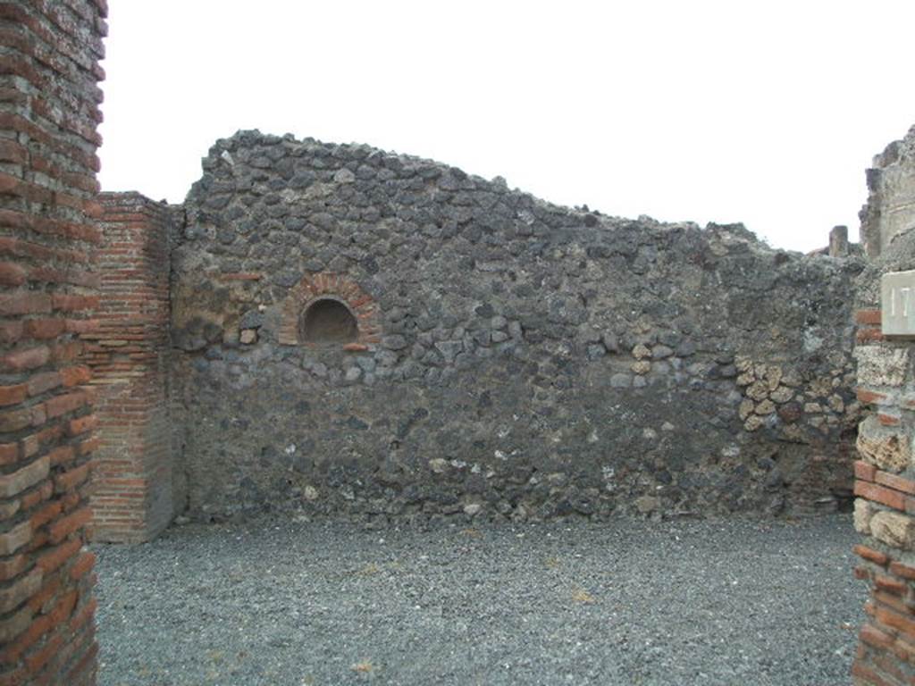 VI.14.17 Pompeii. May 2006. Looking west towards west wall, from entrance. According to Boyce, in the west wall of the main room was an arched niche. See Boyce G. K., 1937. Corpus of the Lararia of Pompeii. Rome: MAAR 14. (p.52, no. 198)
