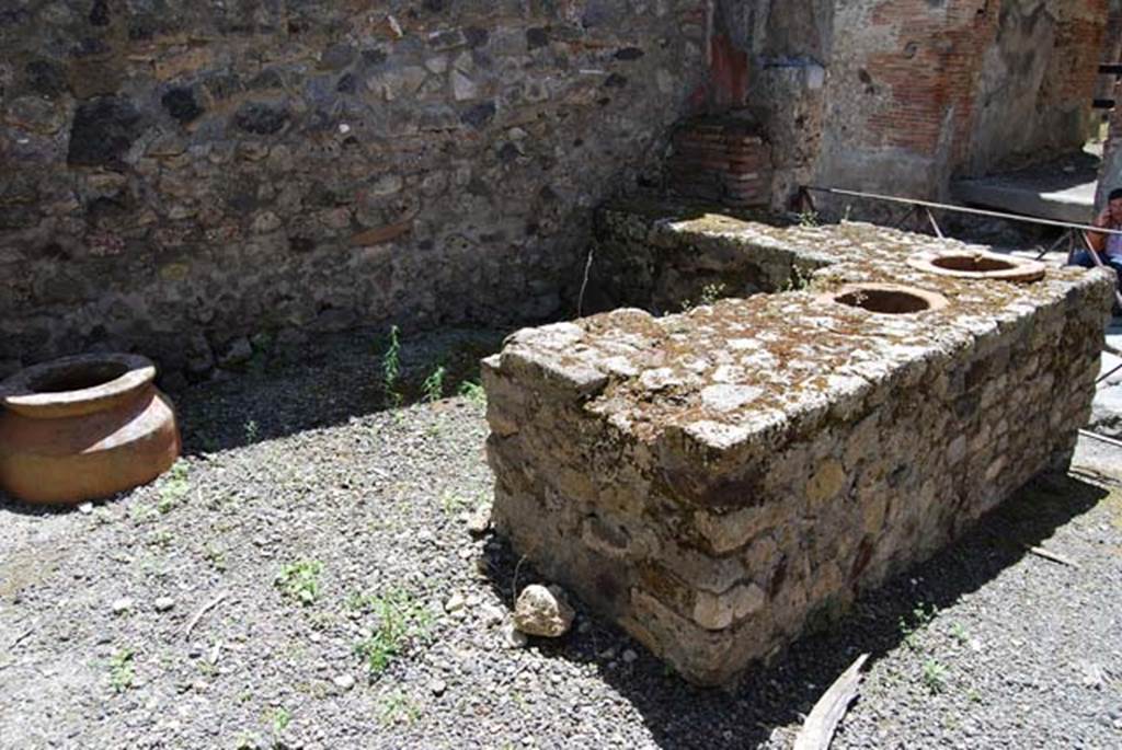 VI.14.36 Pompeii. May 2013. Looking south-west across counter towards shelves in corner.
Photo courtesy of Paula Lock.
