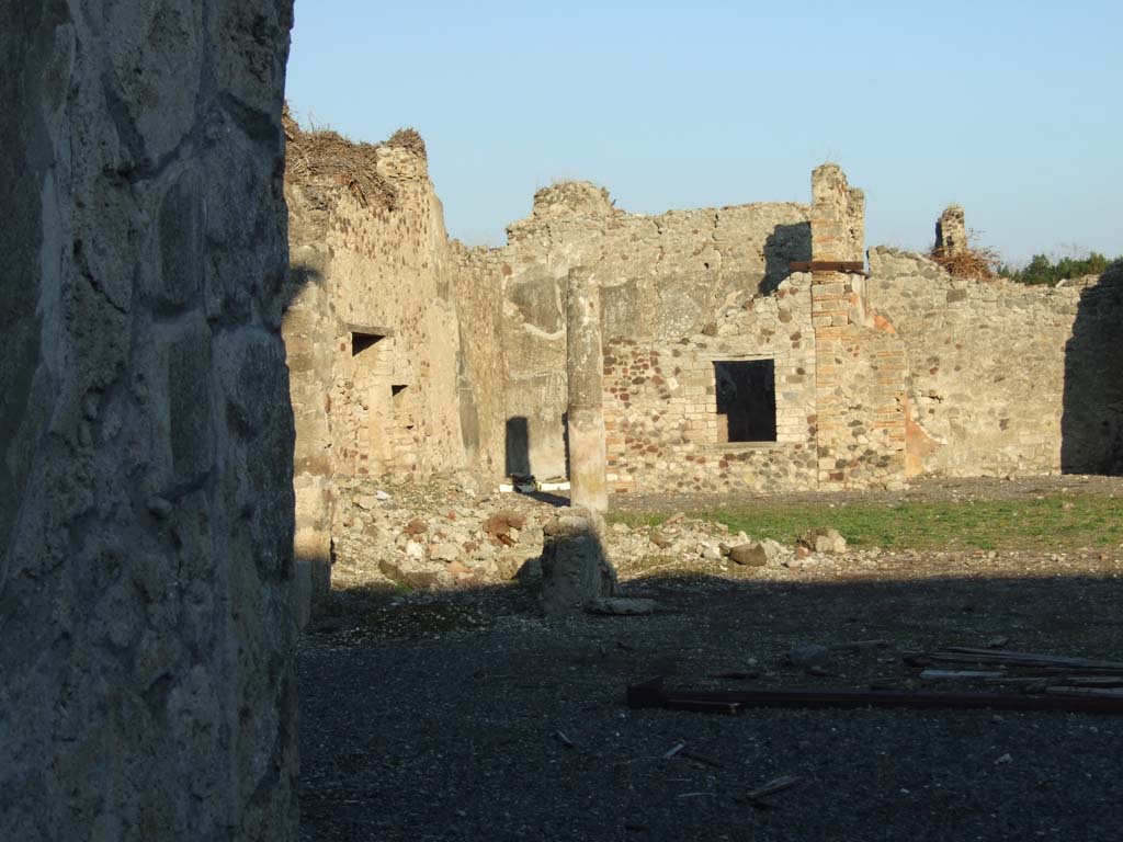 VI.14.38 Pompeii. December 2007. North-east corner of peristyle, and rear rooms.
According to Della Corte, this other commodious and ample dwelling of another member of the same family, C. Poppaeus Firmus, was proved by finding his name on an amphora in the peristyle. It read –
C. Poppaeo Firmo      [CIL IV 5880]
 and then another amphora, with the name of this same citizen expressed by only initials -
C. P(oppaeo) F(irmo)      [CIL IV 6153]  
 and then another, which Della Corte thought was wrongly attributed as being from the house to the east. This read –
C. P(oppaeo) Fir(mo)      [CIL IV 5881]
See Della Corte, M., 1965.  Case ed Abitanti di Pompei. Napoli: Fausto Fiorentino. (p.83)

According to Epigraphik-Datenbank Clauss/Slaby (See www.manfredclauss.de), these read –

C(aio) Poppaeo Firmo    [CIL IV 5880]

P LXXV PT XIII
C(ai) P() F()     [CIL IV 6153]  

C(ai) P(oppaei) Fir(mi)     [CIL IV 5881]
