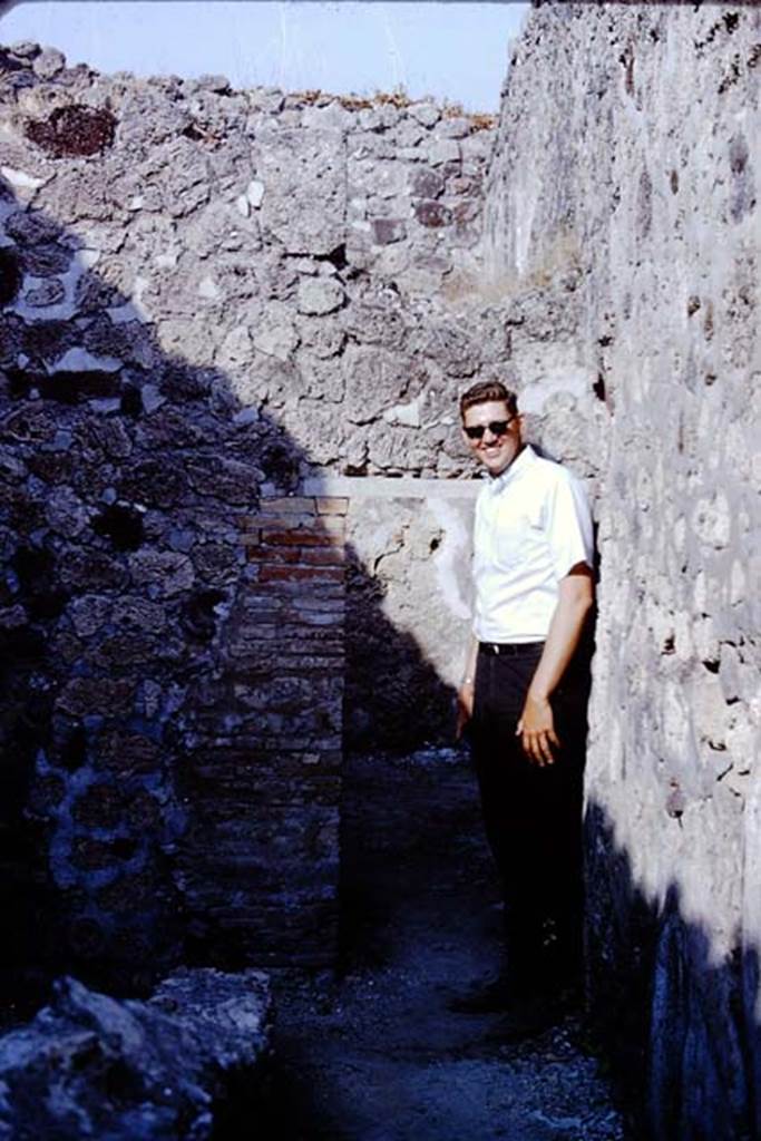 VI.14.41 Pompeii. 1966. Looking east to low doorway in corridor of workshop. 
Photo by Stanley A. Jashemski. 
Source: The Wilhelmina and Stanley A. Jashemski archive in the University of Maryland Library, Special Collections (See collection page) and made available under the Creative Commons Attribution-Non Commercial License v.4. See Licence and use details. J66f0249
