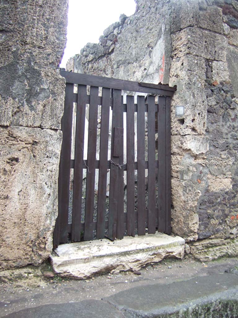 VI.14.42 Pompeii. December 2005. Entrance doorway.
According to Breton, this dwelling discovered in 1846 in the presence of the princess that gave it her name.
In it were found a large quantity of statues, utensils, coins and precious objects.
Today, it is very ruined and offers nothing remarkable.
See Breton, Ernest. 1870. Pompeia, Guide de visite a Pompei, 3rd ed. Paris, Guerin. 

Graffito found outside the doorway in February 1846 was 
Pompeium  o)(ro)  v(os)  f(aciatis)
Inventus  rog(at)      [CIL IV 327}
See Pagano, M. and Prisciandaro, R., 2006. Studio sulle provenienze degli oggetti rinvenuti negli scavi borbonici del regno di Napoli. Naples: Nicola Longobardi, (p. 161). PAH II, 449.

According to Della Corte, this house, spacious and simply decorated, may have been the house of Inventus, because of an electoral recommendation found to the right of the entrance, in support of a specially favoured candidate, perhaps a neighbour, Sesto Pompeio.
Inventus rog(at)     [CIL IV 327]
See Della Corte, M., 1965. Case ed Abitanti di Pompei. Napoli: Fausto Fiorentino. (p.86)
