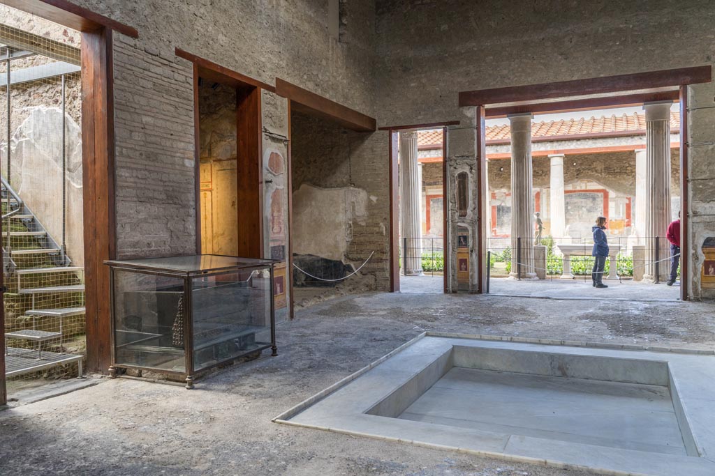 VI.15.1 Pompeii. March 2023. 
Looking south-west across atrium towards south ala, in centre, across impluvium towards peristyle. Photo courtesy of Johannes Eber.
& quickie
