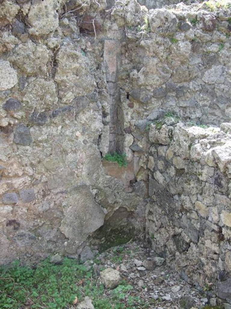 VI.15.5 Pompeii. March 2009. Room 28, south-west corner with downpipe.