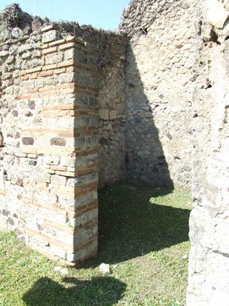 VI.15.5 Pompeii. March 2009. 
Doorway to room 5, cubiculum, looking towards north-west corner. 
This doorway would have had a wooden doorstep.
