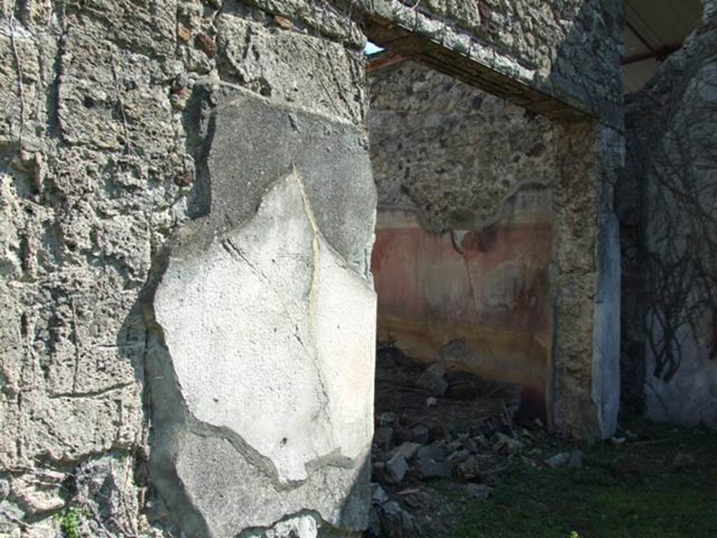 VI.15.5 Pompeii. March 2009. Doorway to room 8, triclinium.  Looking south-east from east portico.