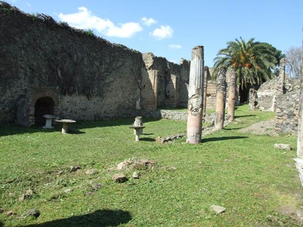 VI.15.5 Pompeii. March 2009.  Garden area 11, looking north-west from east portico, room 12. According to Jashemski, the garden was excavated in 1895-96, it was at the rear of the tablinum. It had a portico supported on the north by two brick pillars, on the east and part of the south by brick columns joined by a low masonry wall. See Jashemski, W. F., 1993. The Gardens of Pompeii, Volume II: Appendices. New York: Caratzas. (p.156).
