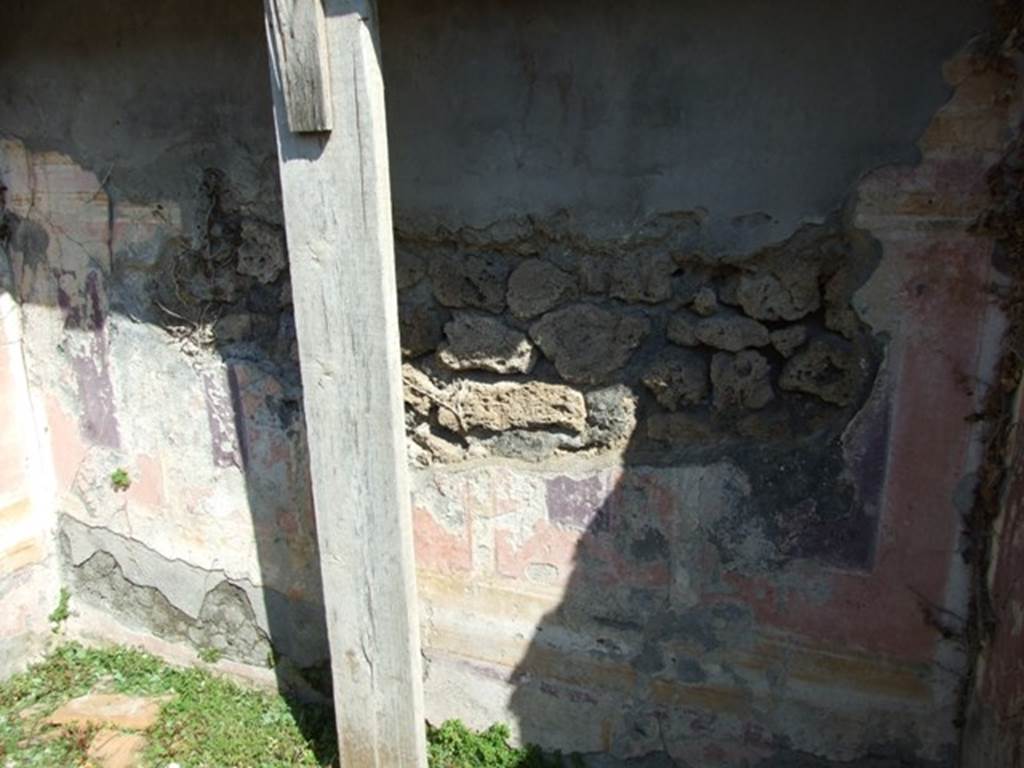 VI.15.5 Pompeii. March 2009. Room 14, east wall of cubiculum, with remains of painted decoration.