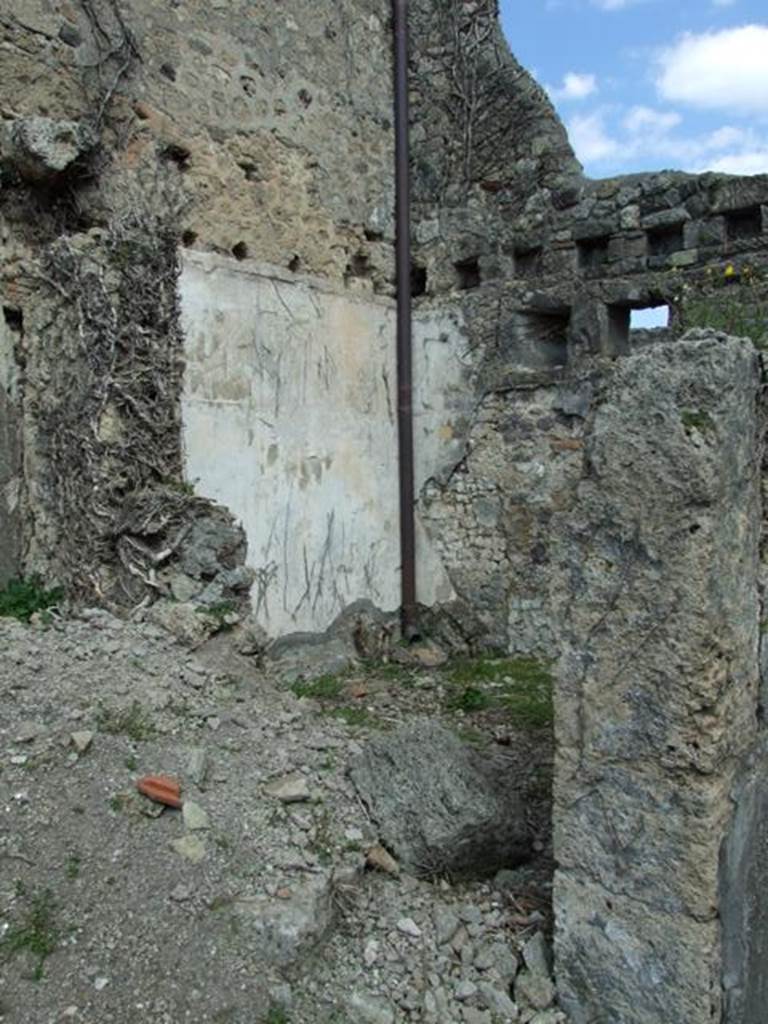 VI.15.6 Pompeii. March 2009. Doorway to room 2, cubiculum on north side of entrance corridor. Looking north-east. On the left would have been the remains of the stairs to the upper floor, which would have been above the two rooms at the front of the house, rooms 2 and 3. Holes for the beam supports for the upper floor can be seen in the north and east walls, in the above photo.
