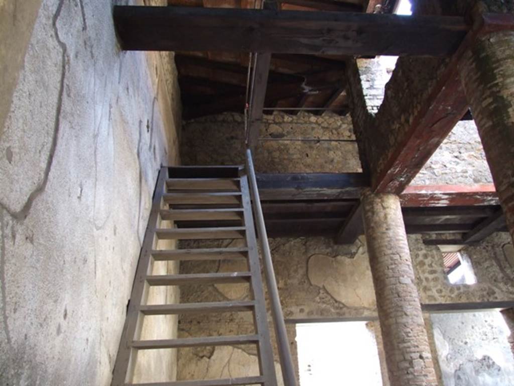 VI.15.9 Pompeii. March 2009. Reconstructed modern staircase to upper floor above atrium.