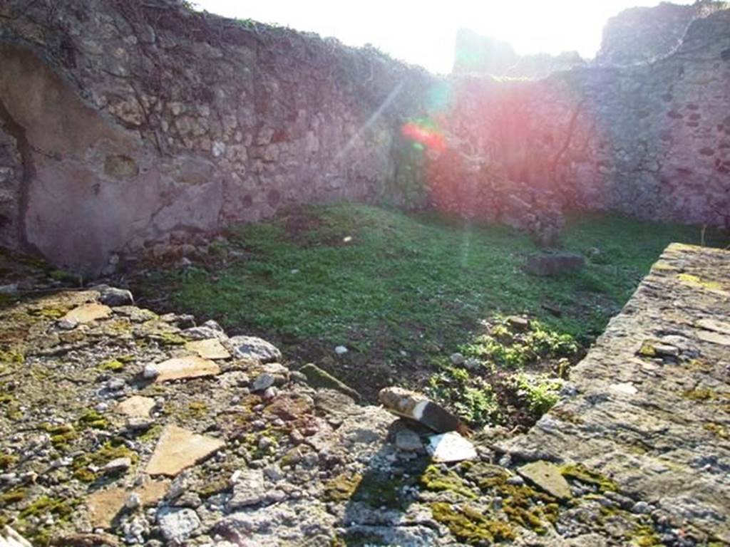 VI.15.16 Pompeii. December 2007. Looking south-west across counter in bar-room, towards west wall with doorway to rear room.