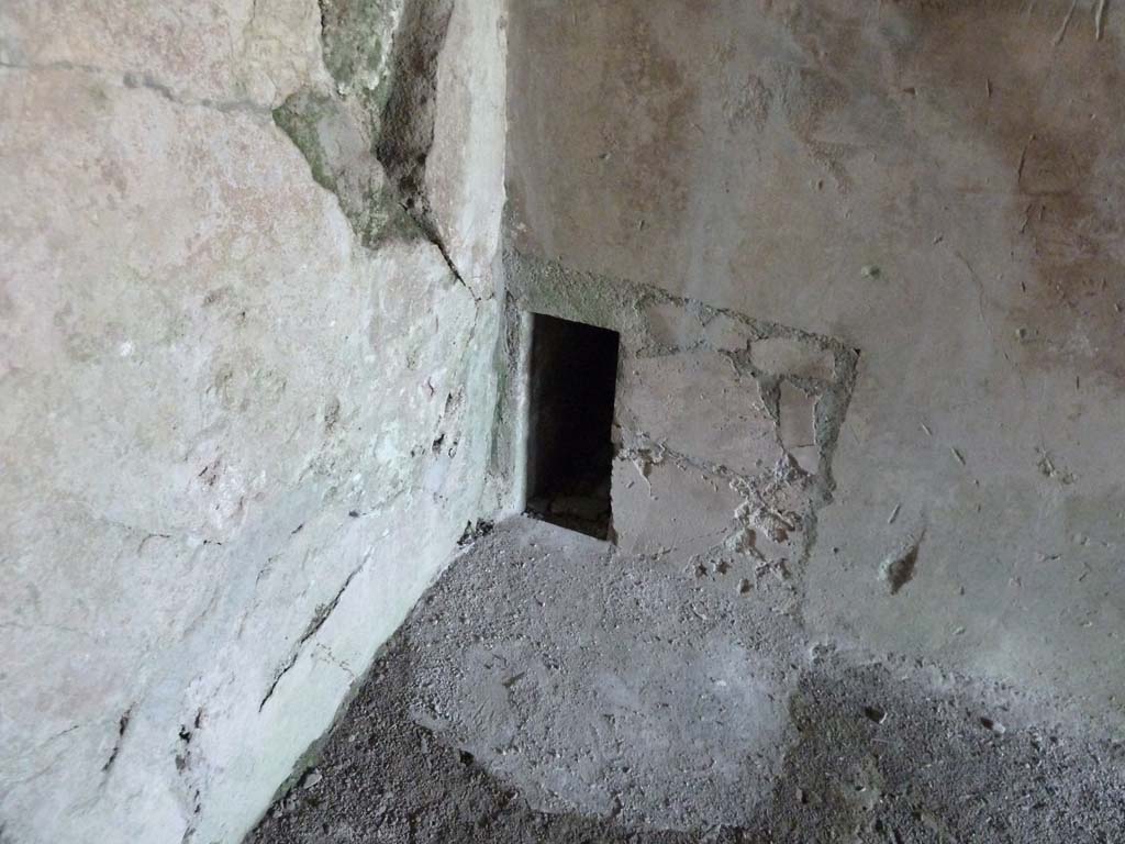 VI.16.7 Pompeii. May 2010. Room J, north-east corner, hole at floor level.