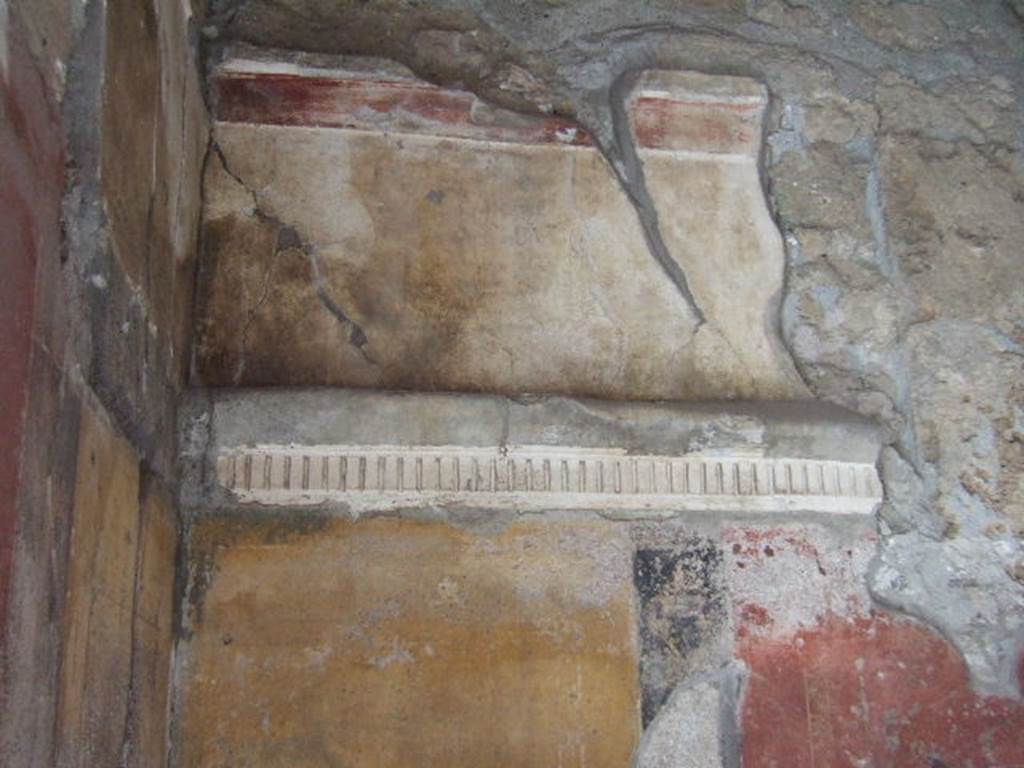 VI.16.7 Pompeii. May 2006. Room C, north wall. Upper zone and remains of denticulated cornice.