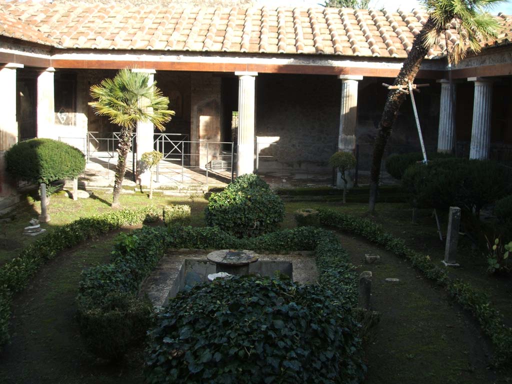 VI.16.7 Pompeii. December 2004. Room F, peristyle garden, looking towards east portico.