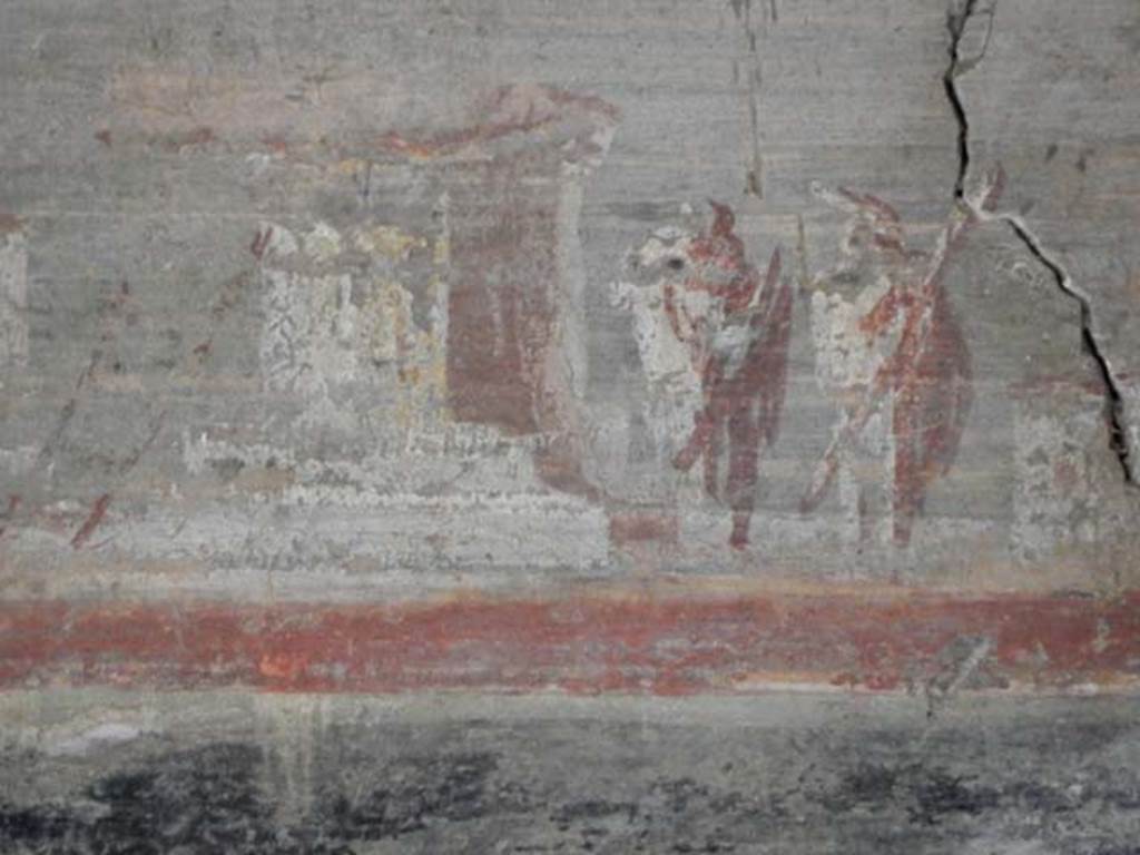 VI.16.7 Pompeii. May 2016. 
Room F, detail of lower part of painting on west wall above doorway to room R. Photo courtesy of Buzz Ferebee.

