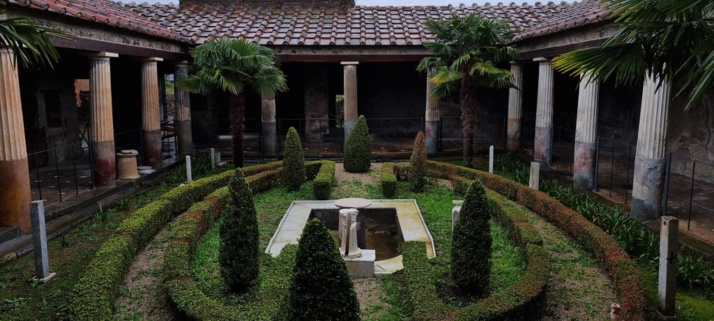 VI.16.7 Pompeii. January 2023. Room F, looking east across peristyle garden. Photo courtesy of Miriam Colomer.