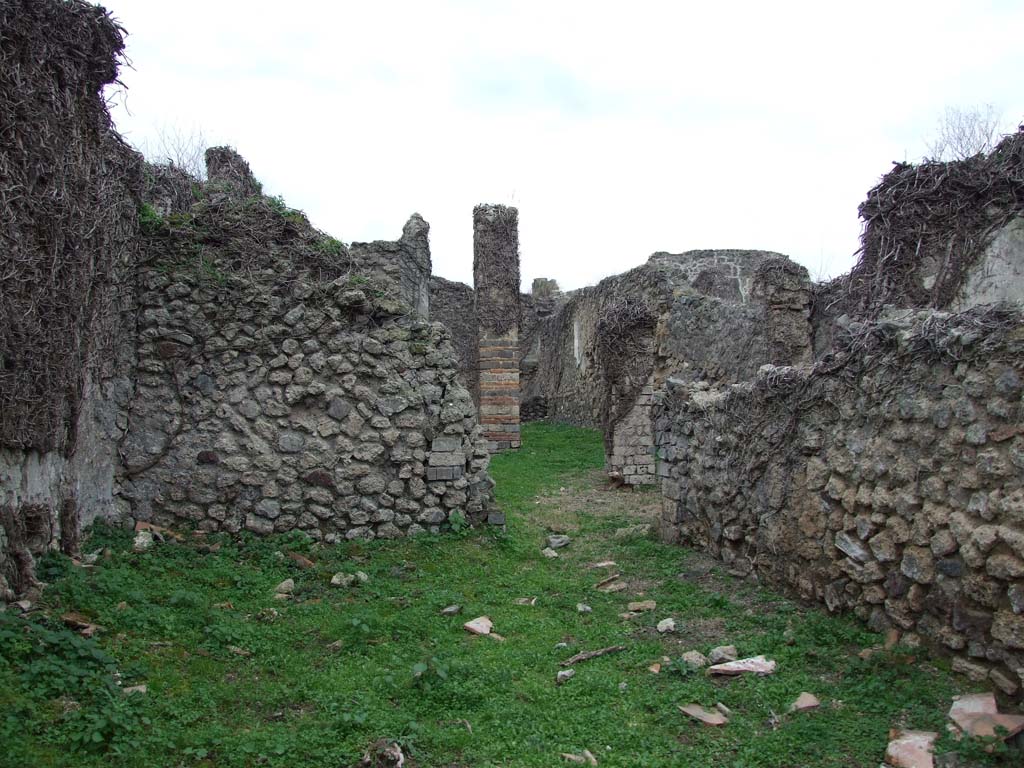 VI.16.10 Pompeii. December 2007. Looking west towards doorway to atrium, or corridor, in west wall.