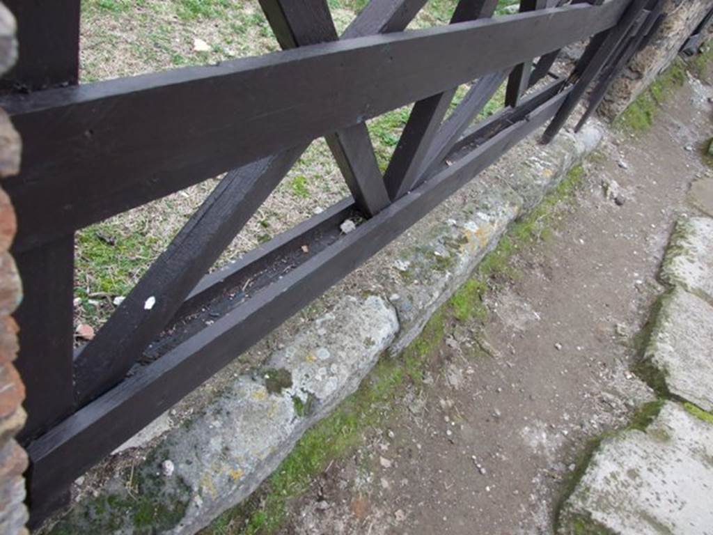 VI.16.13 Pompeii. December 2007. Threshold or sill. The lava threshold is seen with its usual groove for the shutters to close.
