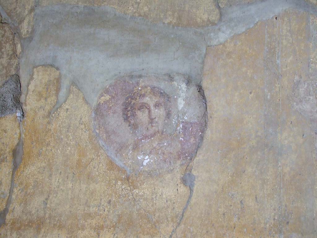 VI.16.15 Pompeii. December 2006. North end of east wall of room G with detail of painted medallion bust.