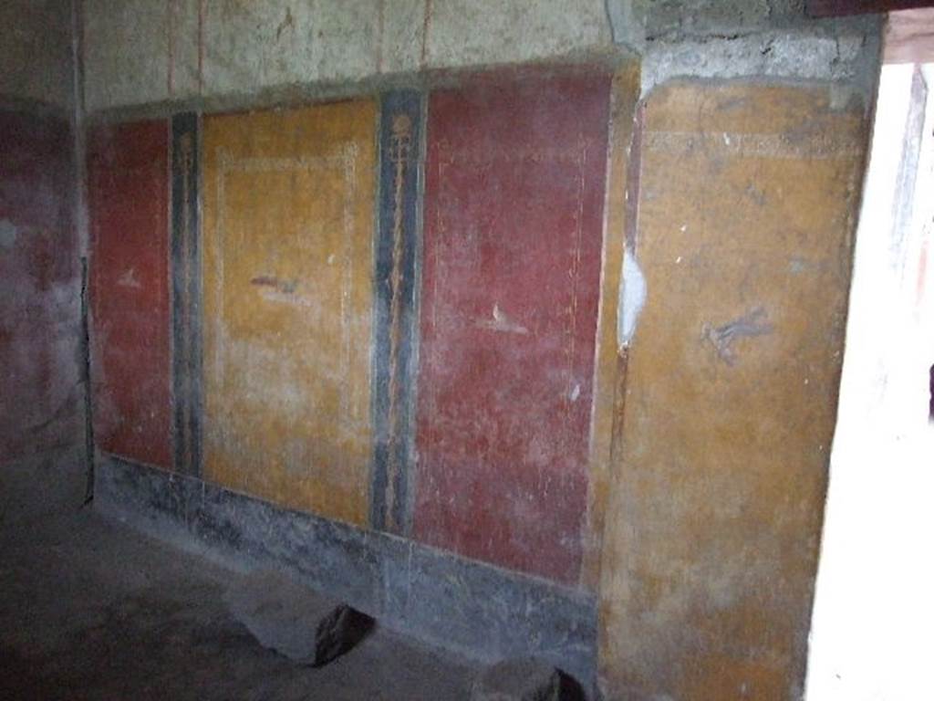 VI.16.15 Pompeii. December 2006. West wall of room H. According to NdS, the right side of the door was formed by a pilaster sticking out into the inside of the room. This pilaster served to support the architrave. This same pillar divided the room into two parts. The south part was larger and covered with a vaulted ceiling; the other to the north was smaller and had a flat ceiling.