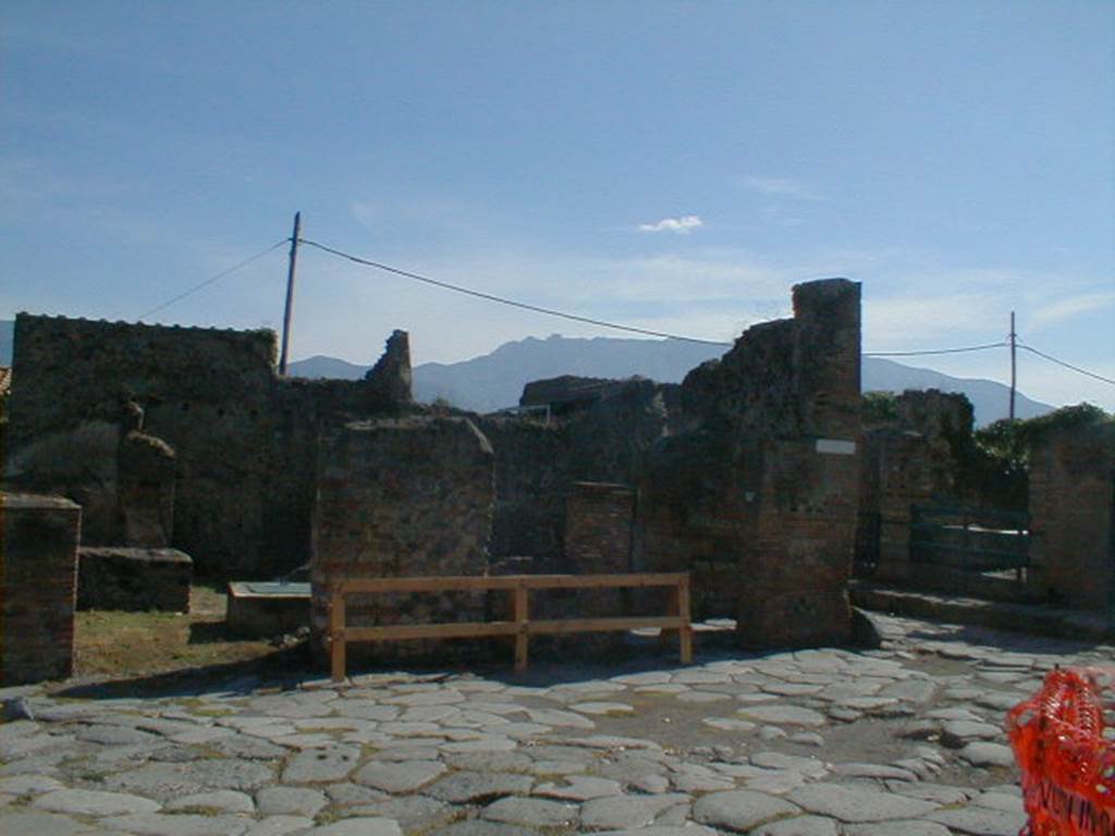 VI.16.22 Pompeii, September 2004,      and                    VI.6.23 entrance doorways.   According to Della Corte, grape-gatherers were stationed here. He thought this because of the electoral programme found here between entrances VI.16.22 and 23 –
Casellium aed(ilem)  Vindemitores rog (ant)      [CIL IV 6672]
See Della Corte, M., 1965.  Case ed Abitanti di Pompei. Napoli: Fausto Fiorentino. (p.87)
According to Varone and Stefani, found on the east side (left) of entrance 23 (between 22 and 23) was CIL IV 6671.  Found on the west side (right) of entrance 23 was CIL 6672.  Neither of the inscriptions have been preserved.  See Varone, A. and Stefani, G., 2009. Titulorum Pictorum Pompeianorum, Rome: L’erma di Bretschneider, (p.337 with photo)

According to Epigraphik-Datenbank Clauss/Slaby (See www.manfredclauss.de), these read –
Caellium
aed(ilem)SV[3]       [CIL IV 6671]
Casellium
Vindemitores
aed(ilem) rog(ant)       [CIL IV 6672]


