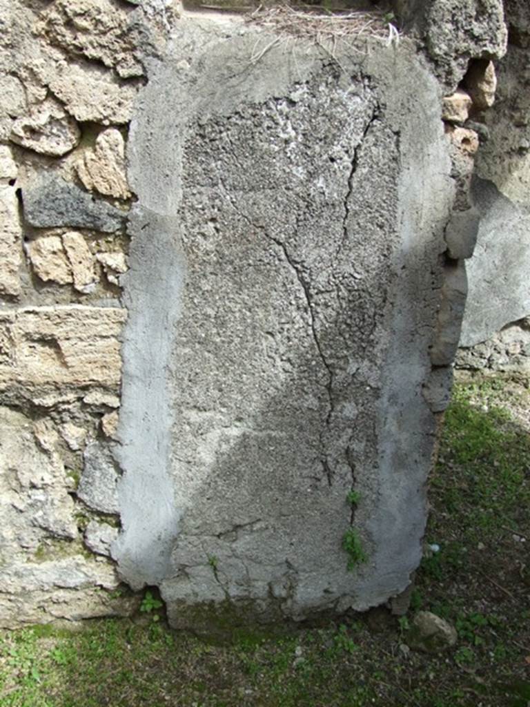 VI.16.27 Pompeii. March 2009.  Remains of plaster below niche on east wall, room Y.
