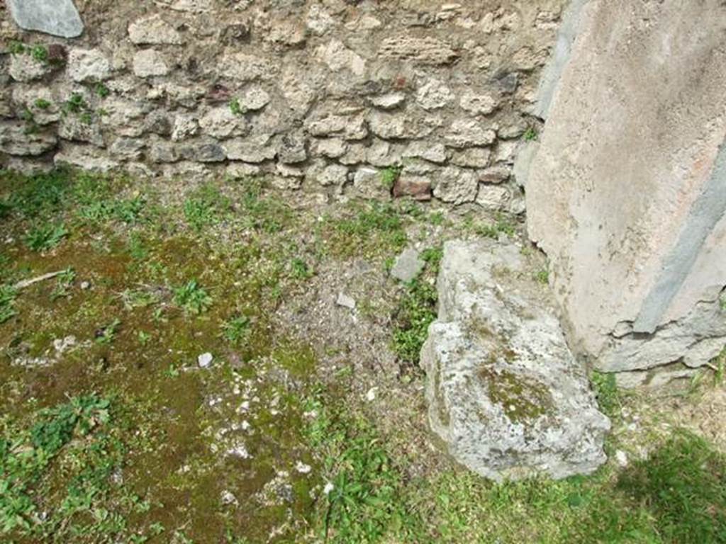 VI.16.29 Pompeii. March 2009. Room O, base of staircase to upper floor in north-east corner of atrium of VI.16.30.  According to NdS, this area had an upper mezzanine, to which one went up by a staircase of which one could see the first step in Sarno stone at the foot of the north wall.