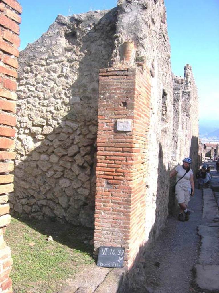 VI.16.37 Pompeii. July 2008. Downpipe in brick door pilaster on south side of entrance doorway.  Photo courtesy of Barry Hobson.
