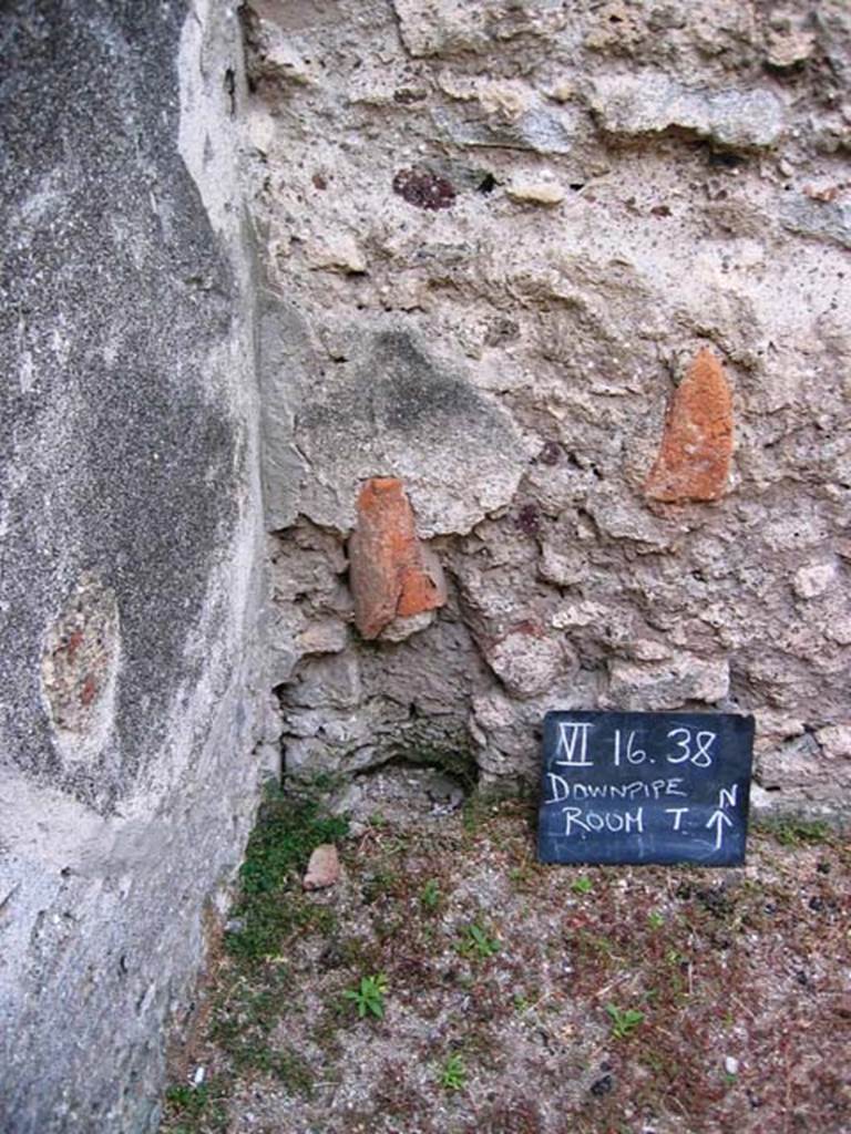 VI.16.38 Pompeii. July 2008. Looking north into north-west corner of dormitory or storeroom, with downpipe. Photo courtesy of Barry Hobson.