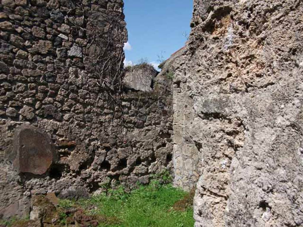 VI.16.7 Pompeii. May 2010. North-east corner of kitchen, from doorway.