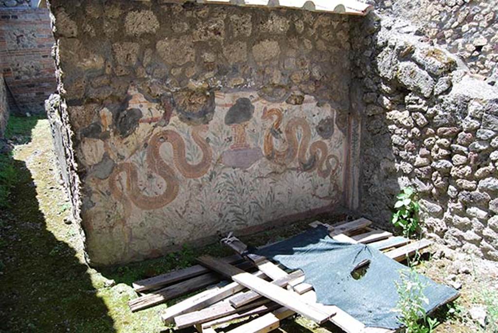 VI.16.40 Pompeii. May 2013. Room F, with lararium on west wall. Photo courtesy of Paula Lock.