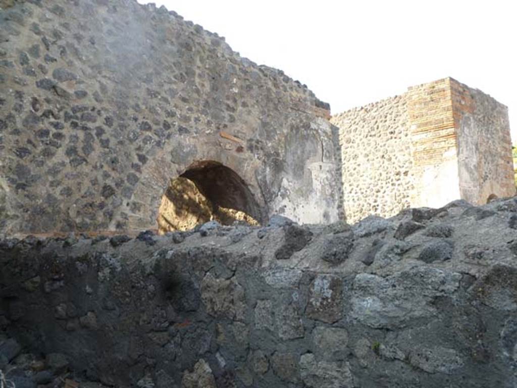 VI.17.1 Pompeii. May 2011. Looking east across front wall of small room, towards the Herculaneum Gate.