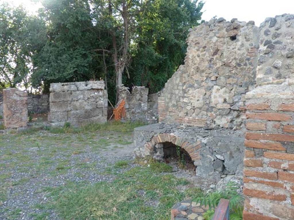 VI.17.1 Pompeii. September 2015. Hearth on north side of entrance doorway.