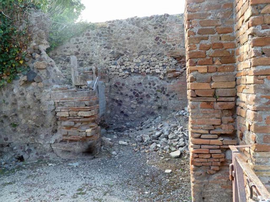 VI.17.23 Pompeii. May 2011. Looking towards small room on north side of shop at VI.17.24, leading to entrance to VI.17.23. Photo courtesy of Michael Binns.
