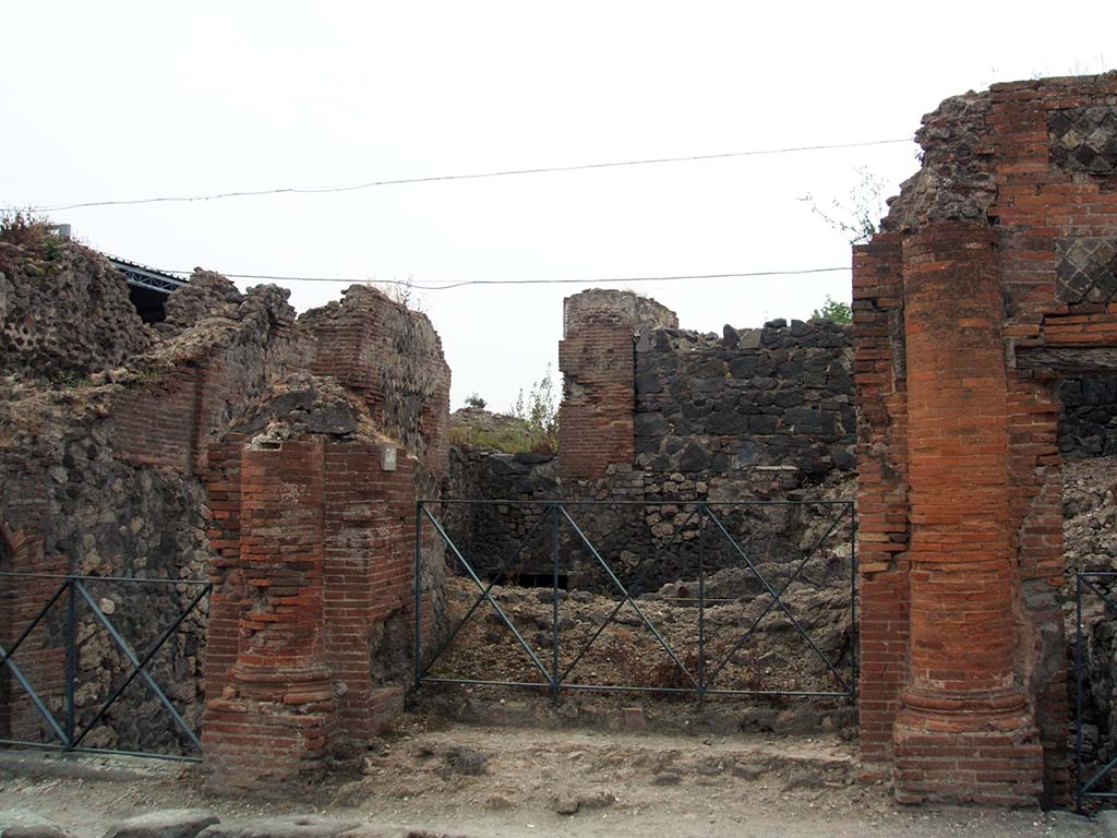 VI.17.36 Pompeii. May 2005. Entrance doorway with two half round side columns, and with remains of steps to vestibule. 
According to PAH, the external façade of this house was clad with white stucco, with squarings imitating large stones, and between them were seen distinct lines coloured blue.
Found painted in red in November 1807 on the left side of the doorway, was the electoral recommendation  –
C(aium) Iulium Polybium II vir(um)
Vatia rog(at)    [CIL IV 132]

See Pagano, M. and Prisciandaro, R., 2006. Studio sulle provenienze degli oggetti rinvenuti negli scavi borbonici del regno di Napoli. Naples: Nicola Longobardi. (p.97)   
PAH I, 2, 89.
