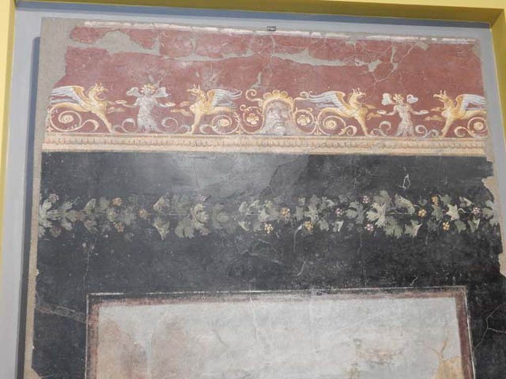 VI.17.42, Pompeii, May 2018. Triclinium 20, upper north wall above central painting. Photo courtesy of Buzz Ferebee.